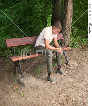 Sad men sitting on the bench 118011441