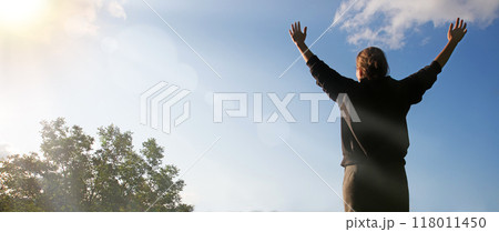 Happy girl pray to God 118011450