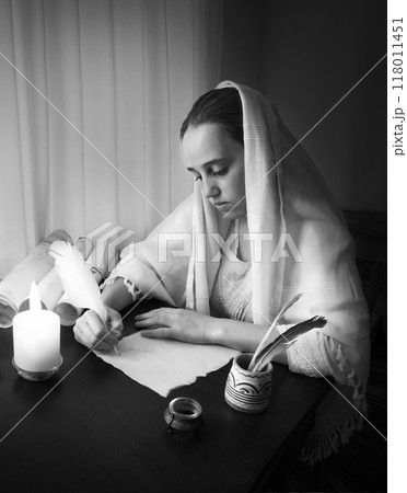 Woman write letter on vintage paper for writing on wooden table Woman write letter on vintage paper for writing on wooden table 118011451