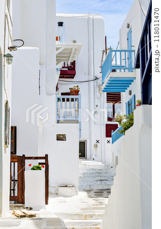 Myconos, views of the white houses with their cobbled streets. Village bathed by the South Aegean Sea, in the Cyclades, Greece Myconos, views of the white houses with their cobbled streets. Village bathed by the South Aegean Sea, in the Cyclades, Greece 118011470