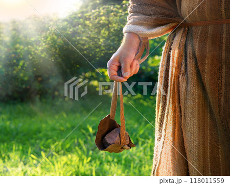 Man's hand with an old sling 118011559