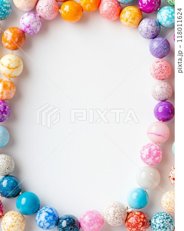 A beautiful array of colorful beads arranged in a circular pattern, highlighting various sizes and designs ideal for jewelry crafting or fashion statements A beautiful array of colorful beads arranged in a circular pattern, highlighting various sizes and designs ideal for jewelry crafting or fashion statements 118011624