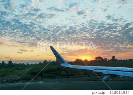 Sunrise and wing of airplane (JFK or another airport) Sunrise and wing of airplane (JFK or another airport) 118011934