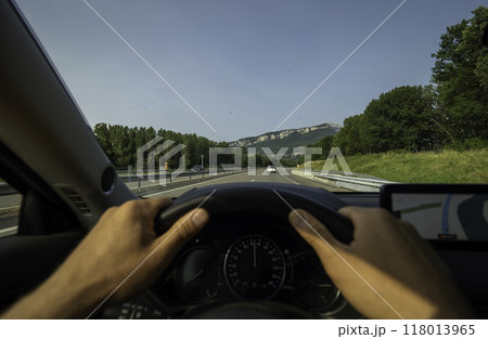 Driving on highway with mountain view 118013965