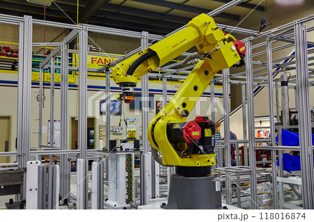 Yellow Robotic Arm in High-Tech Factory Setting 118016874