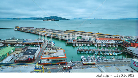 Pier 45 aerial over San Francisco Bay with Alcatraz Prison Island in distance, CA 118016902