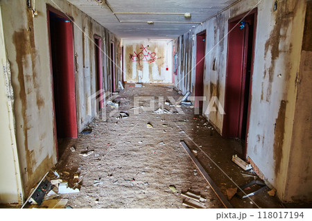 Abandoned Hotel Corridor with Graffiti and Debris, Urbex Mood 118017194