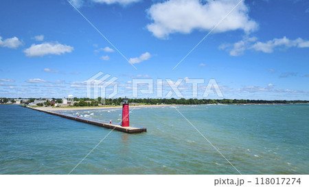 Aerial View of Red Lighthouse on Pier with Calm Lake Michigan Waters 118017274