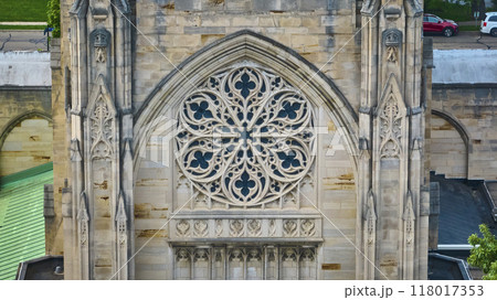 Gothic Cathedral Rose Window Detail with Urban Backdrop Aerial View Gothic Cathedral Rose Window Detail with Urban Backdrop Aerial View 118017353