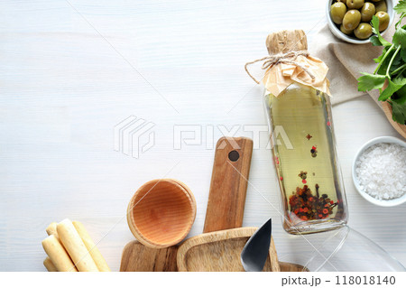 The concept of Italian cuisine, olive oil, on a light background. 118018140