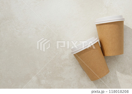 Paper cups with lids on a light background 118018208