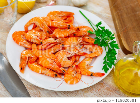 Seafood appetizer. Roasted langostins served with parsley Seafood appetizer. Roasted langostins served with parsley 118020381