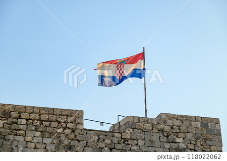 Flag of Croatia atop the walls of the Old Walled City of Dubrovnik, UNESCO world heritage site at the Adriatic Sea in Croatia 118022062