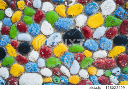 Lots of pebbles and stones painted in different colors. Lots of pebbles and stones painted in different colors. 118022499