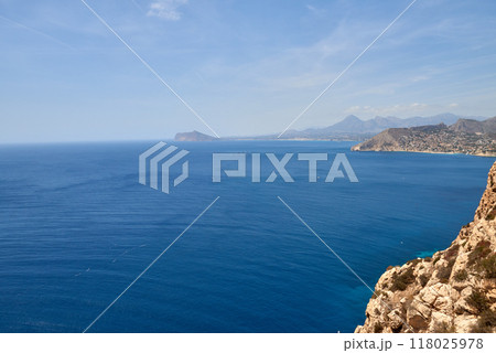Breathtaking Panoramic Mountain View: Majestic Sea, Dramatic Sky, and Rugged Cliff Edge Overlooking Coastal Horizon. Awe-Inspiring Coastal Landscape: Stunning Aerial Perspective of Ocean, Cloudscape 118025978