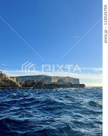 Beautiful view of the cliffs of the island of Gozo, Malta. Blue water of the Mediterranean Sea. 118026766