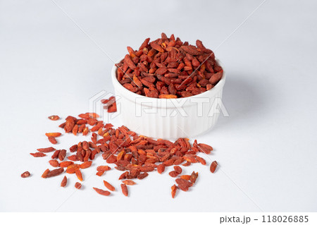 Dried Goji berries in a plate on a white background 118026885