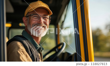 Friendly School Bus Driver Smiling and Ready to Start Route 118027813