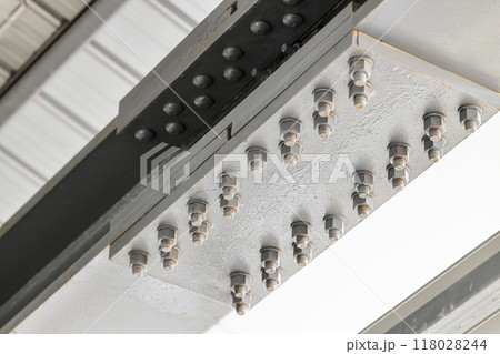 Metal supports Bolts, nuts, threaded on beams of the Steel Construction. Metal supports Bolts, nuts, threaded on beams of the Steel Construction. 118028244