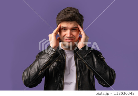 Mature man having hypertension headache, violet studio.Guy putting hands on head Mature man having hypertension headache, violet studio.Guy putting hands on head 118030348