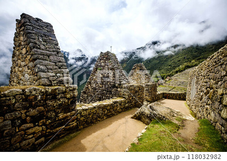 Sunshine view of Machupicchu stone anchient walls and temple among mountains Sunshine view of Machupicchu stone anchient walls and temple among mountains 118032982
