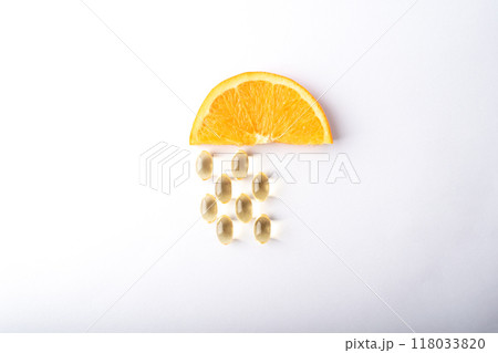 Vitamin C pills. Supplement capsules and orange. Soft vitamins capsule. Treatment and prevention of flu and colds, virus deseases. Healthcare concept banner. High quality photo Vitamin C pills. Supplement capsules and orange. Soft vitamins capsule. Treatment and prevention of flu and colds, virus deseases. Healthcare concept banner. High quality photo 118033820