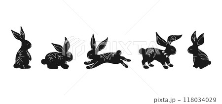 Set of rabbit silhouettes in different poses. Hand drawn rabbits decorated with white ornament with botanical elements. Vector illustration Set of rabbit silhouettes in different poses. Hand drawn rabbits decorated with white ornament with botanical elements. Vector illustration 118034029