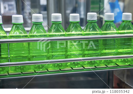 The  empty drinking water bottles  on the conveyor belt for filling process. 118035342