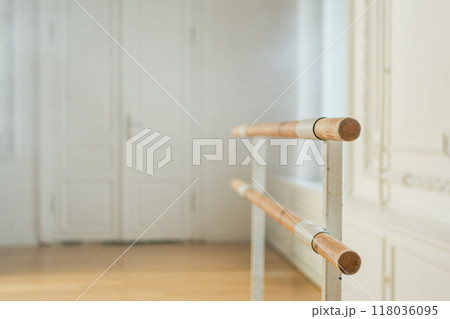 Empty ballet dance studio with barre. Professional ballet barre for stretching practicing dancing positions in dance school Dance hall ready for ballet class training. Ballet school 118036095