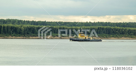 A large cargo sea vessel is at anchor, a dry cargo ship is at anchor 118036102