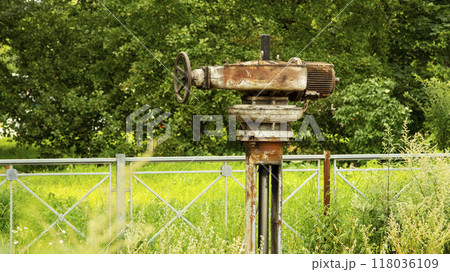 The valve of the Northern Streams gas pipeline is overgrown with grass 118036109