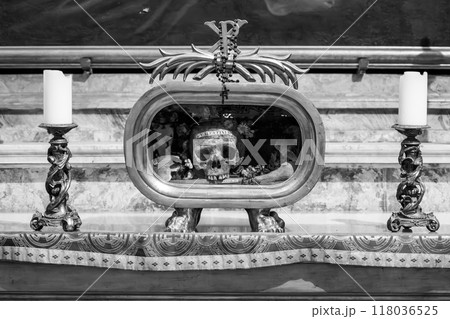 Saint Valentine's remains are shown in a glass case amid candles and decorations at the Basilica of Santa Maria in Cosmedin, Rome, showcasing a piece of religious history. Saint Valentine's remains are shown in a glass case amid candles and decorations at the Basilica of Santa Maria in Cosmedin, Rome, showcasing a piece of religious history. 118036525