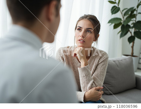Therapy Session with a Thoughtful Young Woman 118036596