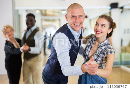 Adult dancing couple enjoying active swing Adult dancing couple enjoying active swing 118036767