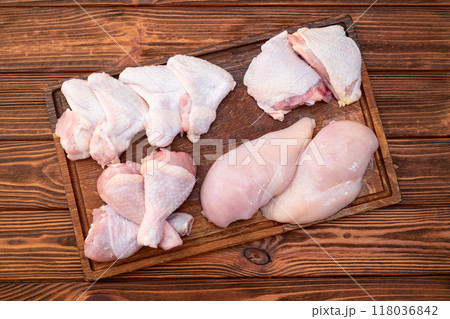Raw mixed chicken meat parts  for cooking on rustic background 118036842