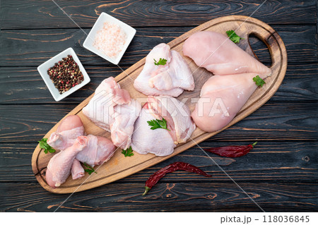 Raw mixed chicken meat parts  for cooking on rustic background 118036845