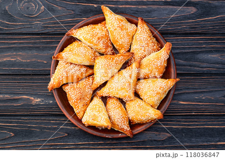 Homemade triangle puff pastry with meat on rustic background . Samosa Homemade triangle puff pastry with meat on rustic background . Samosa 118036847