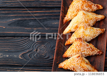 Homemade triangle puff pastry with meat on rustic background . Samosa 118036855