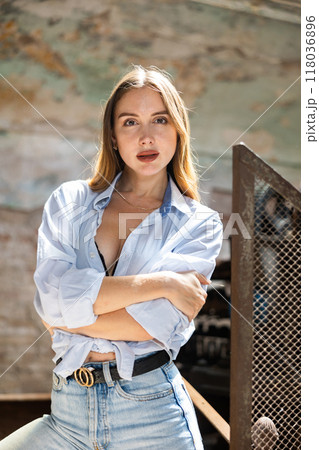 Desirable young woman posing in deserted building 118036896