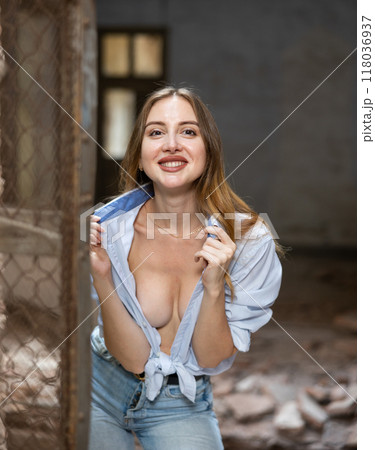 Portrait of attractive woman in abandoned building 118036937