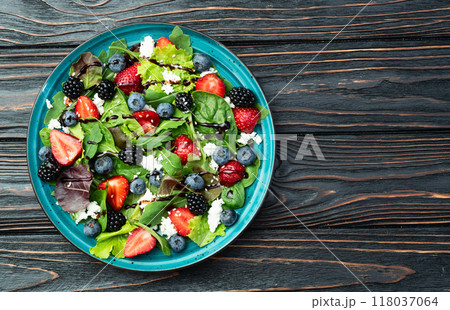 Berries salad (blueberry strawberry blackberry ) with cheese feta and balsamic sauce 118037064