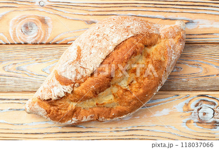Loaf of  wheat hearth bread . Top view 118037066