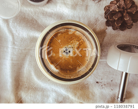 Close up french press espresso coffee shot on white cloth. Close up french press espresso coffee shot on white cloth. 118038791