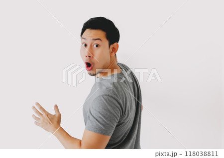 Wow and surprised face of man in grey t-shirt isolated on white background. Wow and surprised face of man in grey t-shirt isolated on white background. 118038811
