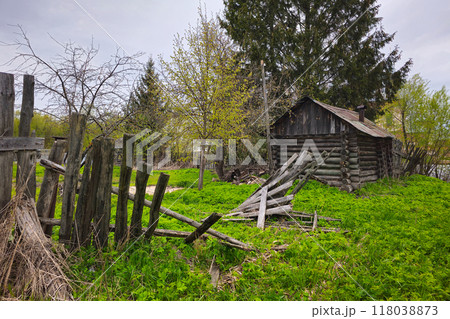 Abandoned old wooden house and ruined wooden fence Abandoned old wooden house and ruined wooden fence 118038873
