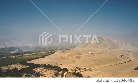 Panoramic view the ancient archaeological site of Caral, near Supe, Barranca Province, Peru. Caral is a UNESCO world heritage site and considered to be the oldest city in the Americas. Panoramic view the ancient archaeological site of Caral, near Supe, Barranca Province, Peru. Caral is a UNESCO world heritage site and considered to be the oldest city in the Americas. 118040485