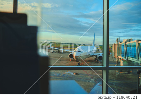 Parked aircraft on City Panama airport through the gate window. Travel concept Parked aircraft on City Panama airport through the gate window. Travel concept 118040521