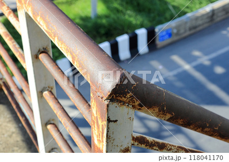Rust of metals on Iron railing or Handrail. Corrosion of metal. Rust and corrosion in the weld. Corrosive Rust on old iron, grunge rust texture. Rust of metals on Iron railing or Handrail. Corrosion of metal. Rust and corrosion in the weld. Corrosive Rust on old iron, grunge rust texture. 118041170