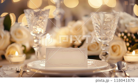 Delicate roses surround a beautifully arranged table, where crystal glasses 118041870