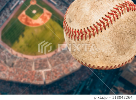 Baseball Flying Through The Air with Stadium in the Background. Baseball Flying Through The Air with Stadium in the Background. 118042264
